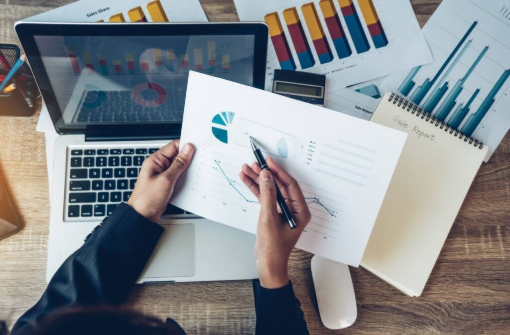 Senior living CFO using real-time data, spreadsheets, and a laptop to protect operating margins.